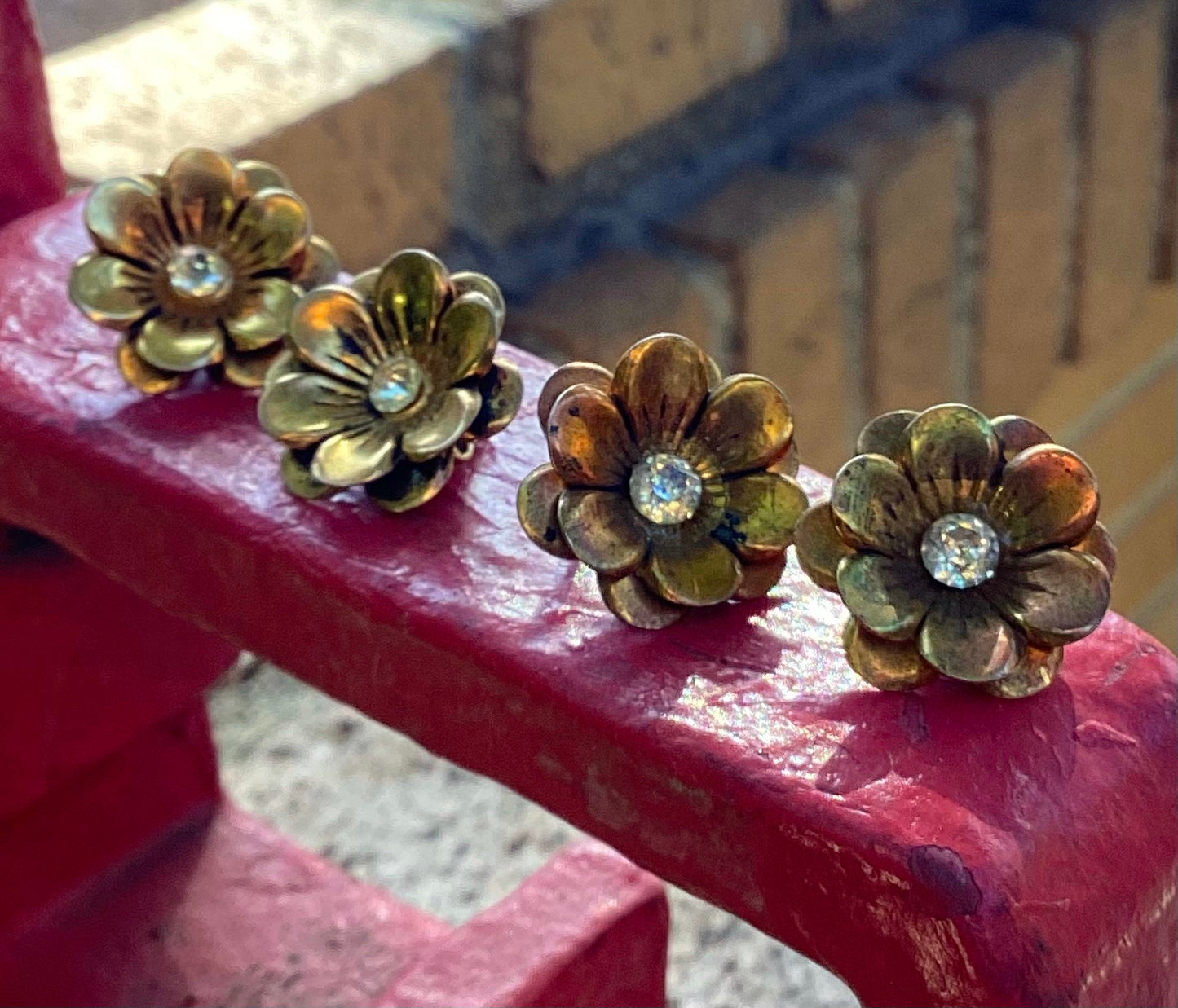 Two pairs of 1930-40's vintage gold plated flower earrings with rhinestone center