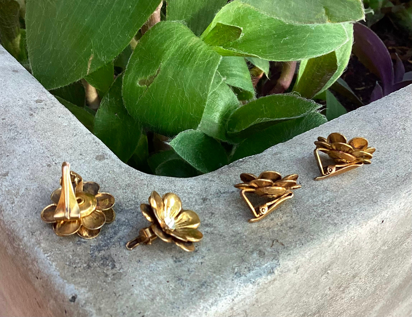 Two pairs of 1930-40's vintage gold plated flower earrings with rhinestone center