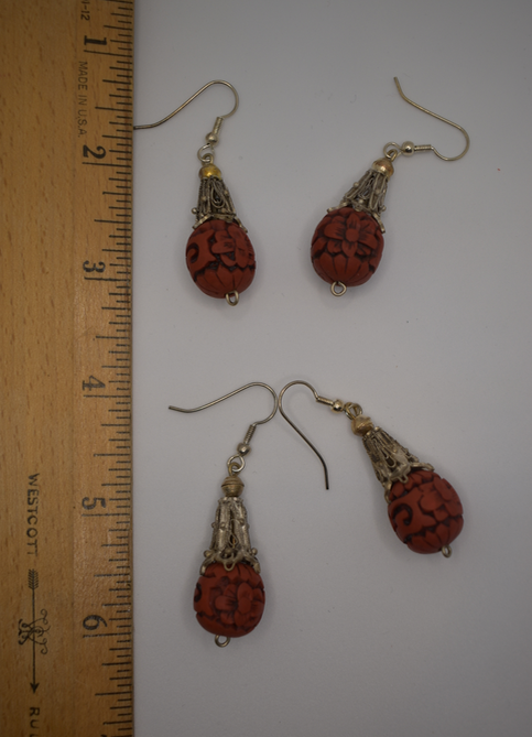 Two pairs of vintage bohemian style silver tone and red cinnabar dangle earrings