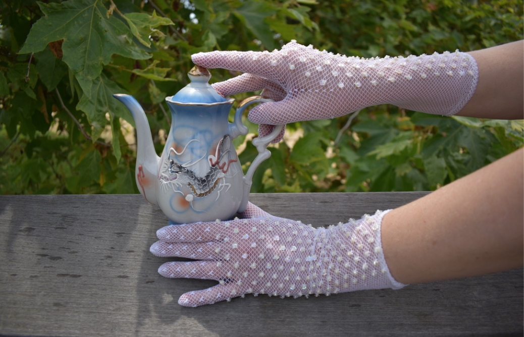 Two pairs of vintage cream lace gloves with iridescent sequins