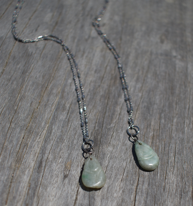 Two Qing Dynasty (circa 1644-1911) vintage hand carved jadite pendants on sterling silver chain