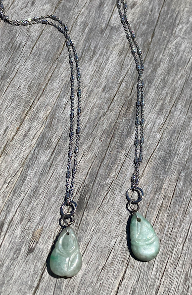 Two Qing Dynasty (circa 1644-1911) vintage hand carved jadite pendants on sterling silver chain