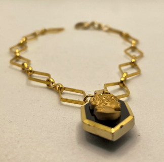 One 18K Gold Plated Bracelet with Vintage Black and Gold Cameo Charm