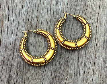One pair of 1990's vintage YSL gold tone hoop earrings