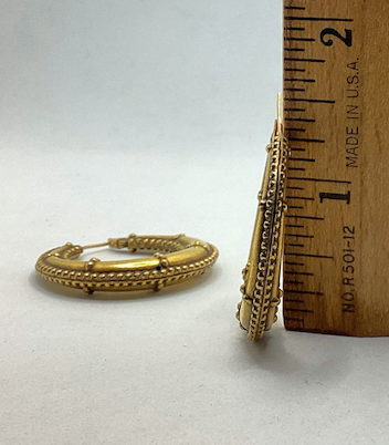 One pair of 1990's vintage YSL gold tone hoop earrings