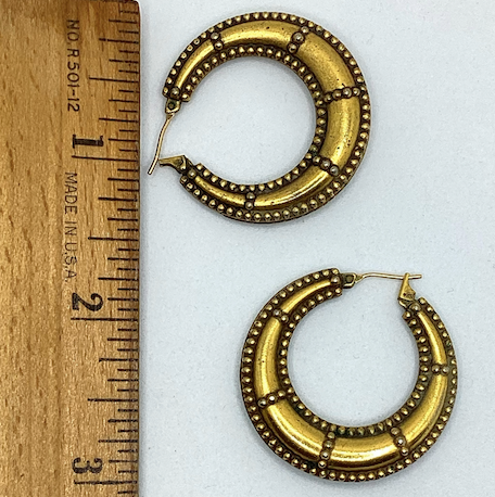 One pair of 1990's vintage YSL gold tone hoop earrings