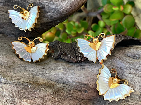 Two pairs of vintage 1970's Mother of Pearl butterfly clip on earrings.