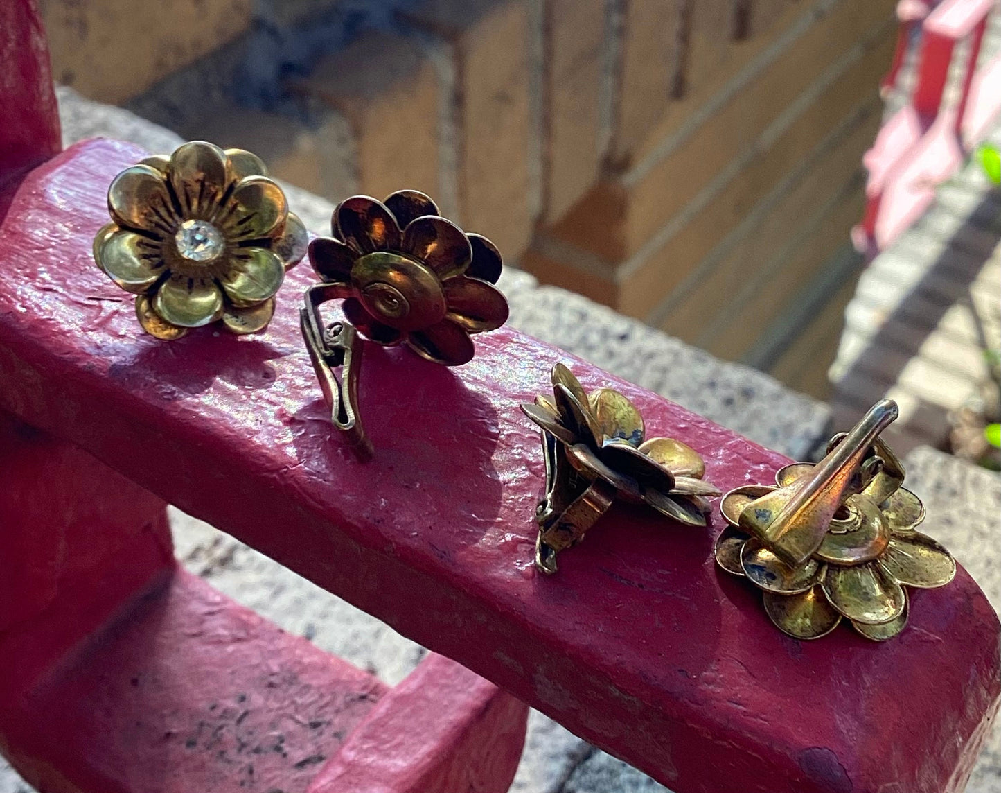 Two pairs of 1930-40's vintage gold plated flower earrings with rhinestone center