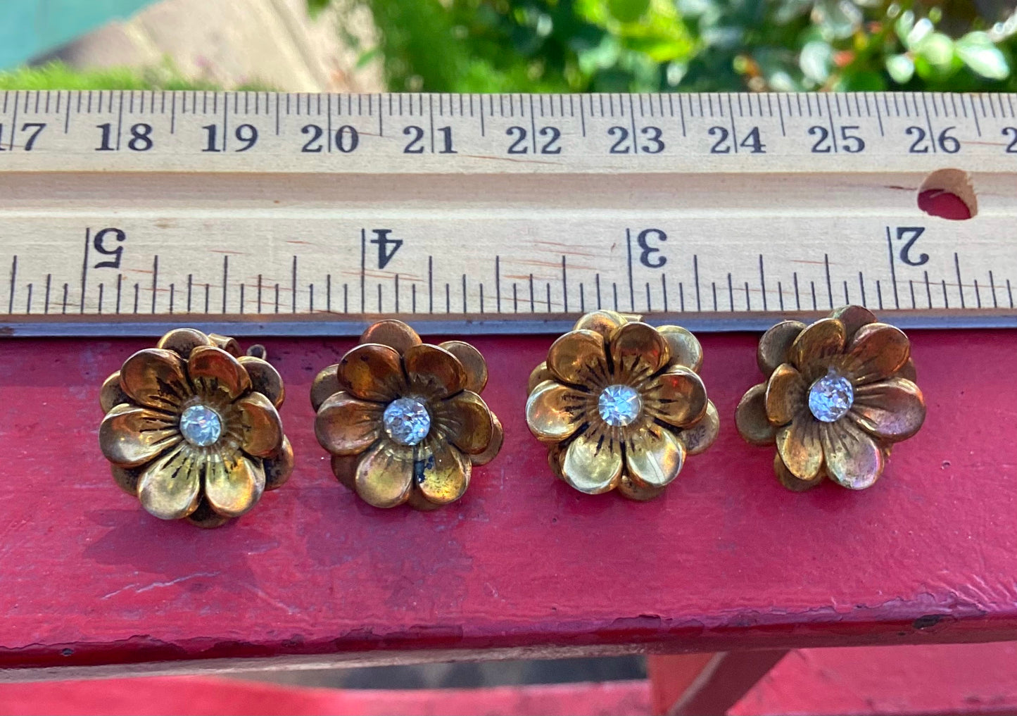 Two pairs of 1930-40's vintage gold plated flower earrings with rhinestone center