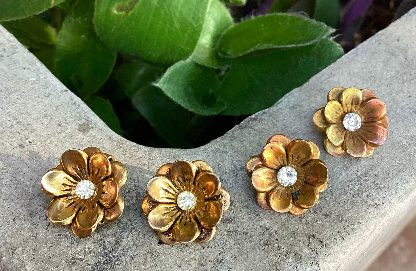 Two pairs of 1930-40's vintage gold plated flower earrings with rhinestone center
