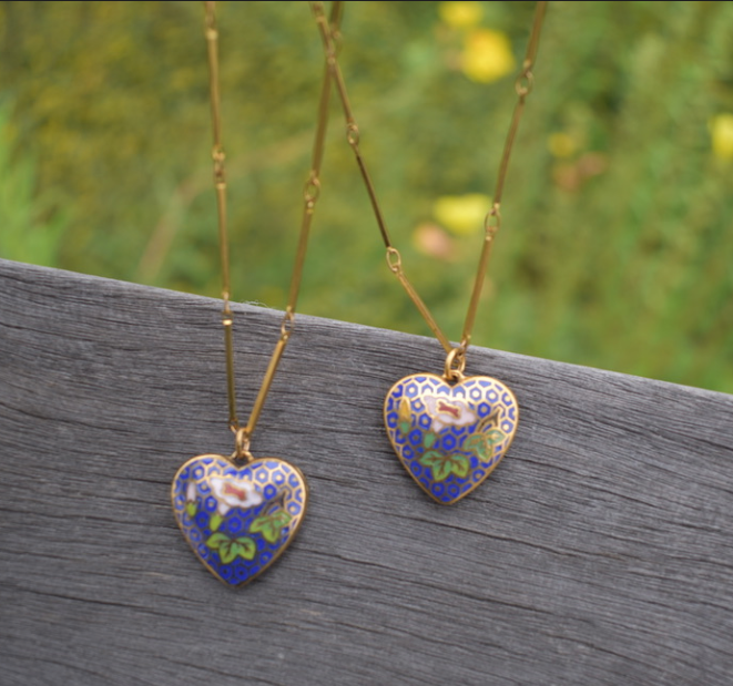 Two 1970's-90's vintage blue cloisonne heart pendants on a gold tone chain