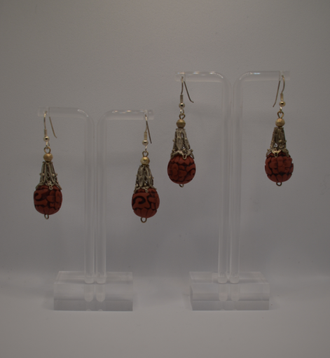 Two pairs of vintage bohemian style silver tone and red cinnabar dangle earrings