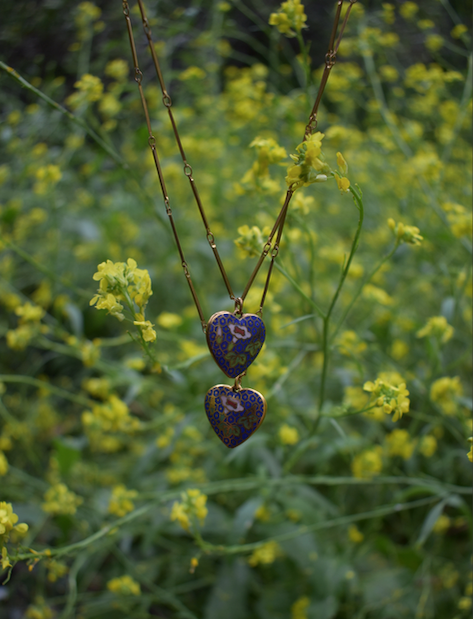 Two 1970's-90's vintage blue cloisonne heart pendants on a gold tone chain