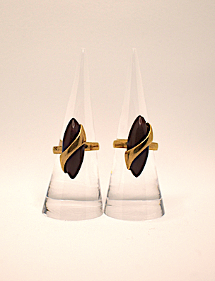 Two 1970s vintage gold tone and burgundy rings