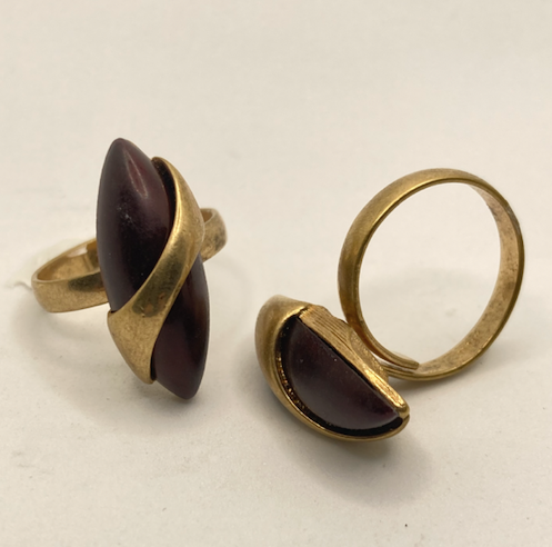 Two 1970s vintage gold tone and burgundy rings