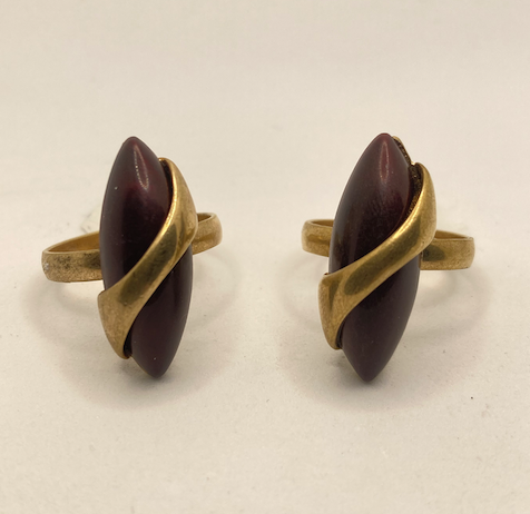 Two 1970s vintage gold tone and burgundy rings