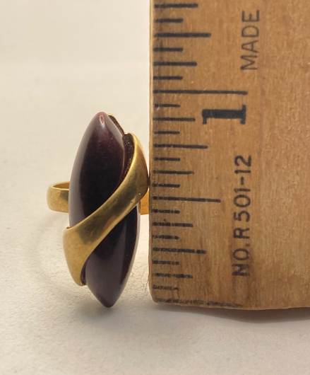 Two 1970s vintage gold tone and burgundy rings