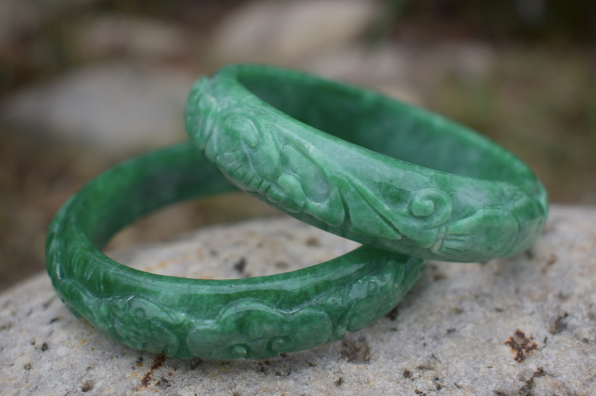 Two matching 1970's-80's vintage hand carved jade bangles