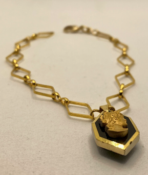 One 18K Gold Plated Bracelet with Vintage Black and Gold Cameo Charm