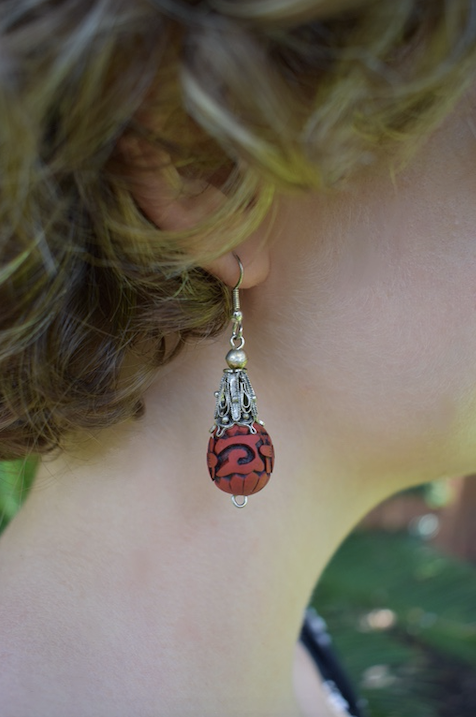 Two pairs of vintage bohemian style silver tone and red cinnabar dangle earrings