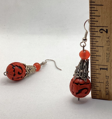 One pair of vintage bohemian style silver tone and red cinnabar dangle earrings