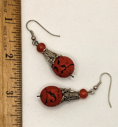 One pair of vintage bohemian style silver tone and red cinnabar dangle earrings