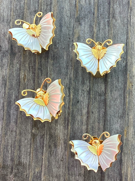 Two pairs of vintage 1970's Mother of Pearl butterfly clip on earrings.
