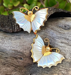 Two pairs of vintage 1970's Mother of Pearl butterfly clip on earrings.